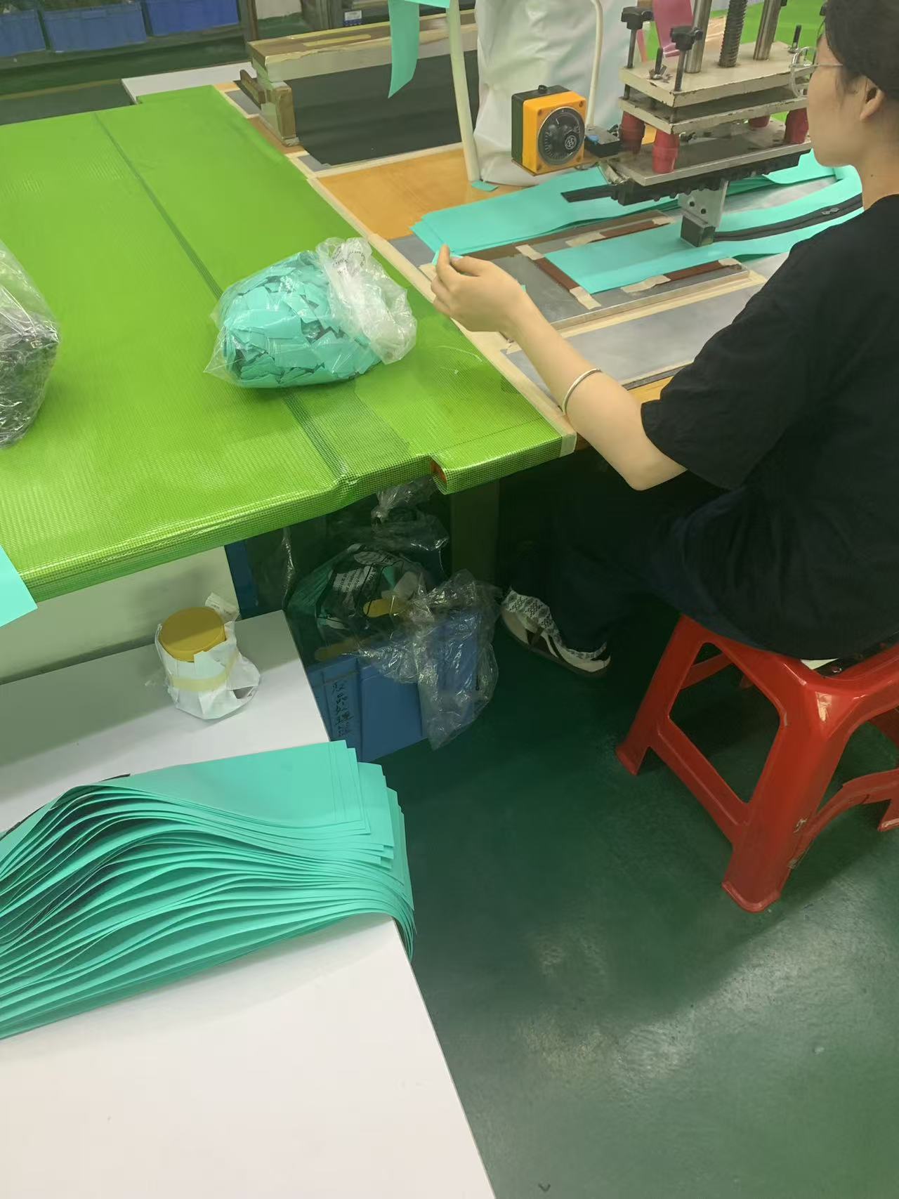 Quality control inspection of a soft cooler backpack at Sealock Vietnam factory.